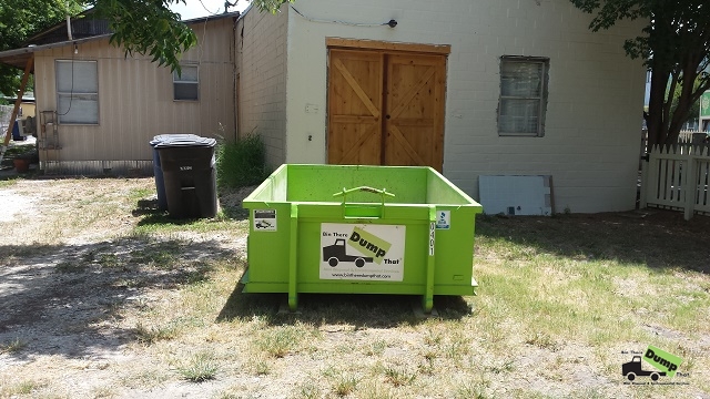 4 yard bin in back yard